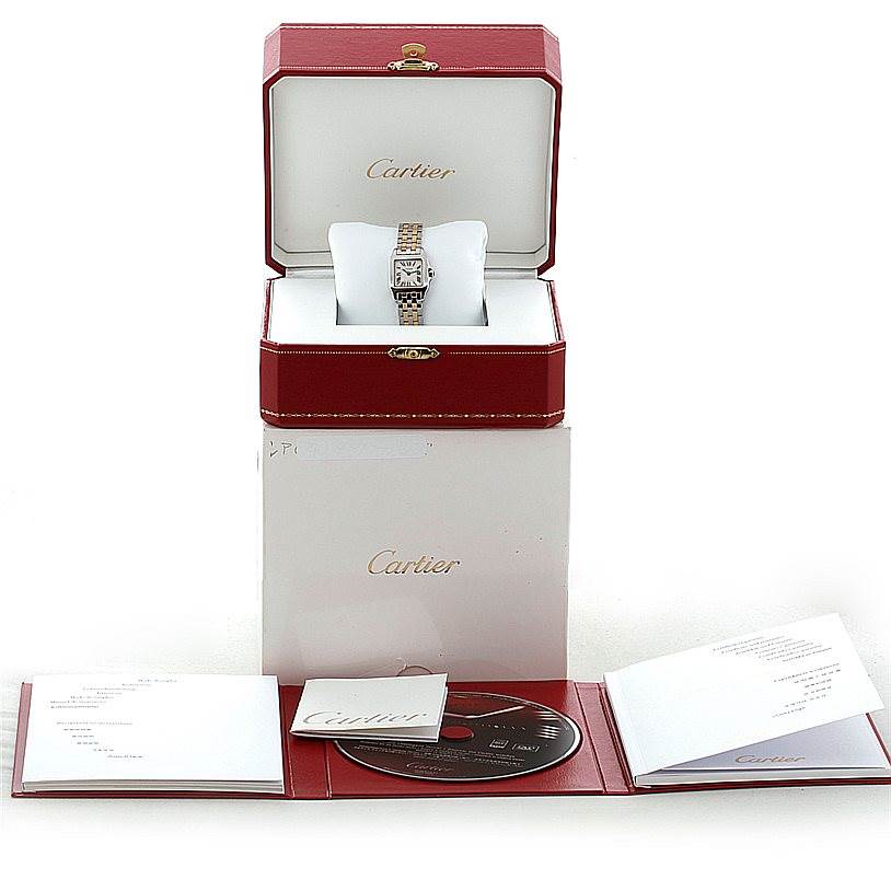 The image shows a Cartier Santos Demoiselle W25066Z6 Women's Steel and Gold (two tone) Silver Dial W25066Z6 Women's Steel and Gold (two tone) Silver Dial watch in its box, with accompanying booklets and a disc.