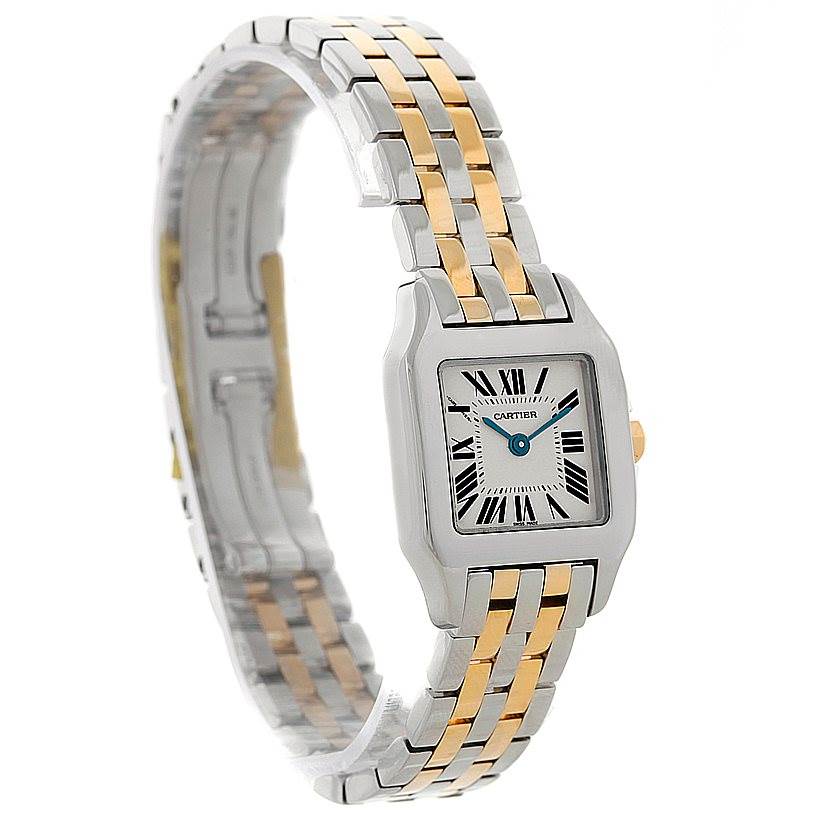 The image showcases a Cartier Santos Demoiselle W25066Z6 Women's Steel and Gold (two tone) Silver Dial W25066Z6 Women's Steel and Gold (two tone) Silver Dial watch from a front-left angle, highlighting its two-tone bracelet and rectangular dial.