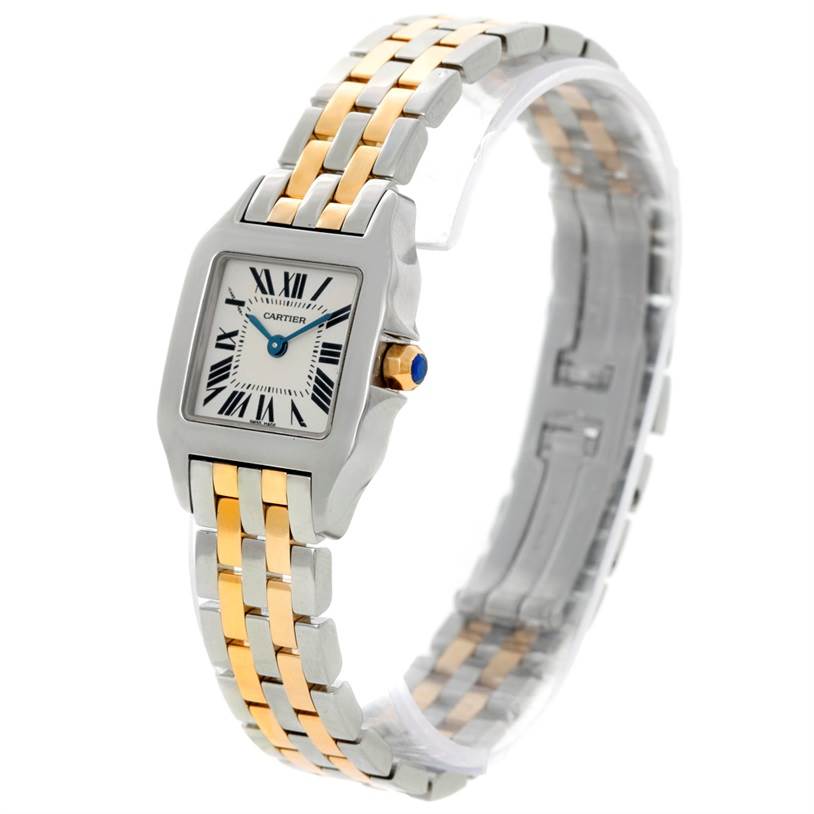 This image shows a Cartier Santos Demoiselle W25066Z6 Women's Steel and Gold (two tone) Silver Dial W25066Z6 Women's Steel and Gold (two tone) Silver Dial watch from a three-quarter angle, highlighting its face, crown, and two-tone bracelet.