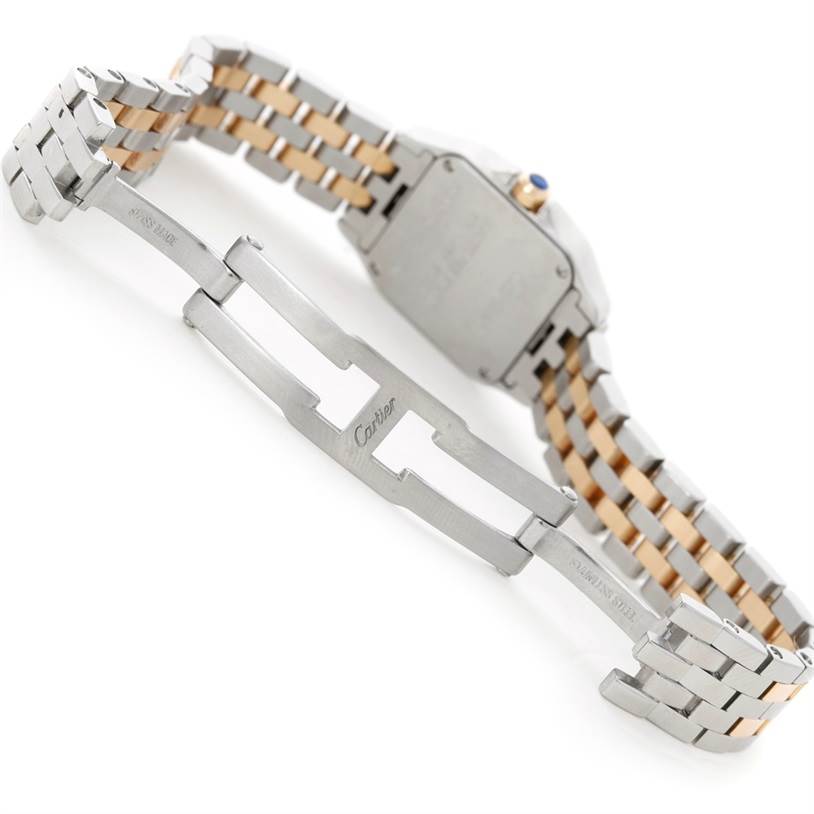 This image shows the open metal bracelet and case back of a Cartier Santos Demoiselle W25066Z6 Women's Steel and Gold (two tone) Silver Dial W25066Z6 Women's Steel and Gold (two tone) Silver Dial watch from a rear angle.