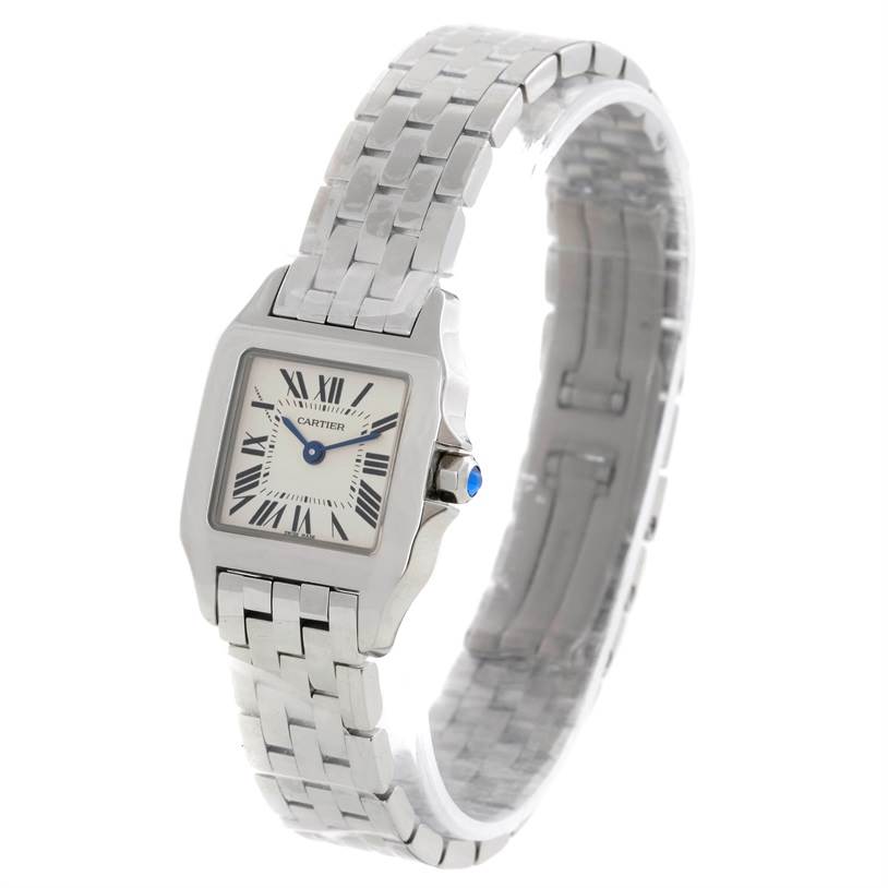 The image shows a Cartier Santos Demoiselle W25064Z5 Women's Stainless Steel Silver Dial W25064Z5 Women's Stainless Steel Silver Dial watch at a slight angle displaying its face and metal bracelet.