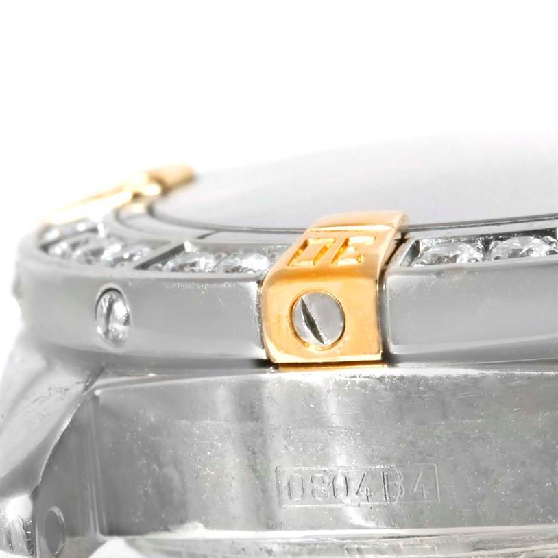 The image shows a close-up of the side view of the Breitling B72345 Women's Stainless Steel Mother of Pearl Dial B72345 Women's Stainless Steel Mother of Pearl Dial Callisto Ladies Steel Gold MOP Diamond Watch A72345, focusing on the bezel and case.