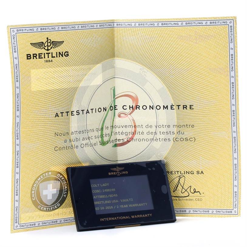 The image shows the Breitling A77388 Women's Stainless Steel Black Dial A77388 Women's Stainless Steel Black Dial Colt Lady Black Dial Steel Womens Watch A77388's warranty card and chronometer certification.