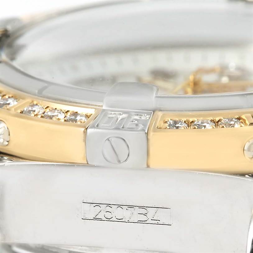 The image shows a close-up of the side view of the bezel and case of the Breitling D71356 Women's Stainless Steel Mother of Pearl Dial D71356 Women's Stainless Steel Mother of Pearl Dial Cockpit Ladies Steel 18K Yellow Gold Diamond Watch D71356.