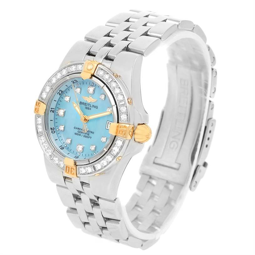 The Breitling WATCH Women's Steel and Gold (two tone) Mother of Pearl Dial WATCH Women's Steel and Gold (two tone) Mother of Pearl Dial Starliner model B71340 watch is shown from an angled side view, highlighting its blue face, diamond-accented bezel, and two-tone metal band.