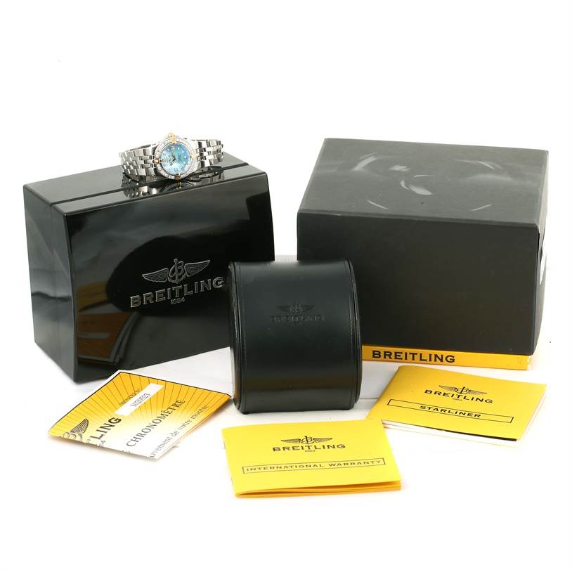 The image shows a Breitling WATCH Women's Steel and Gold (two tone) Mother of Pearl Dial WATCH Women's Steel and Gold (two tone) Mother of Pearl Dial Starliner Steel Yellow Gold Blue MOP Diamond Watch B71340, placed on a black box with accompanying packaging and manuals.