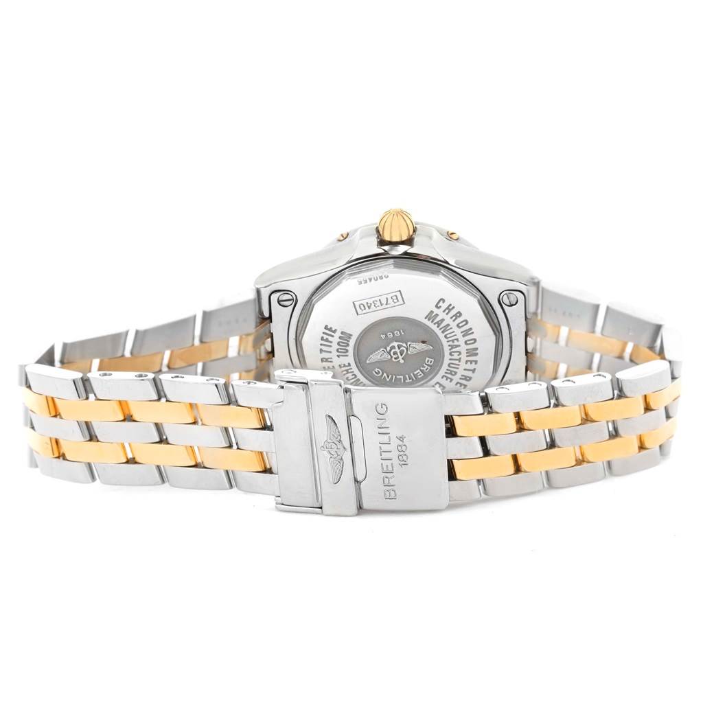 The Breitling B71340 Women's Steel and Gold (two tone) Mother of Pearl Dial B71340 Women's Steel and Gold (two tone) Mother of Pearl Dial Starliner Steel 18K Yellow Gold MOP Dial Ladies Watch B71340 is shown from the back, highlighting the clasp and case back.
