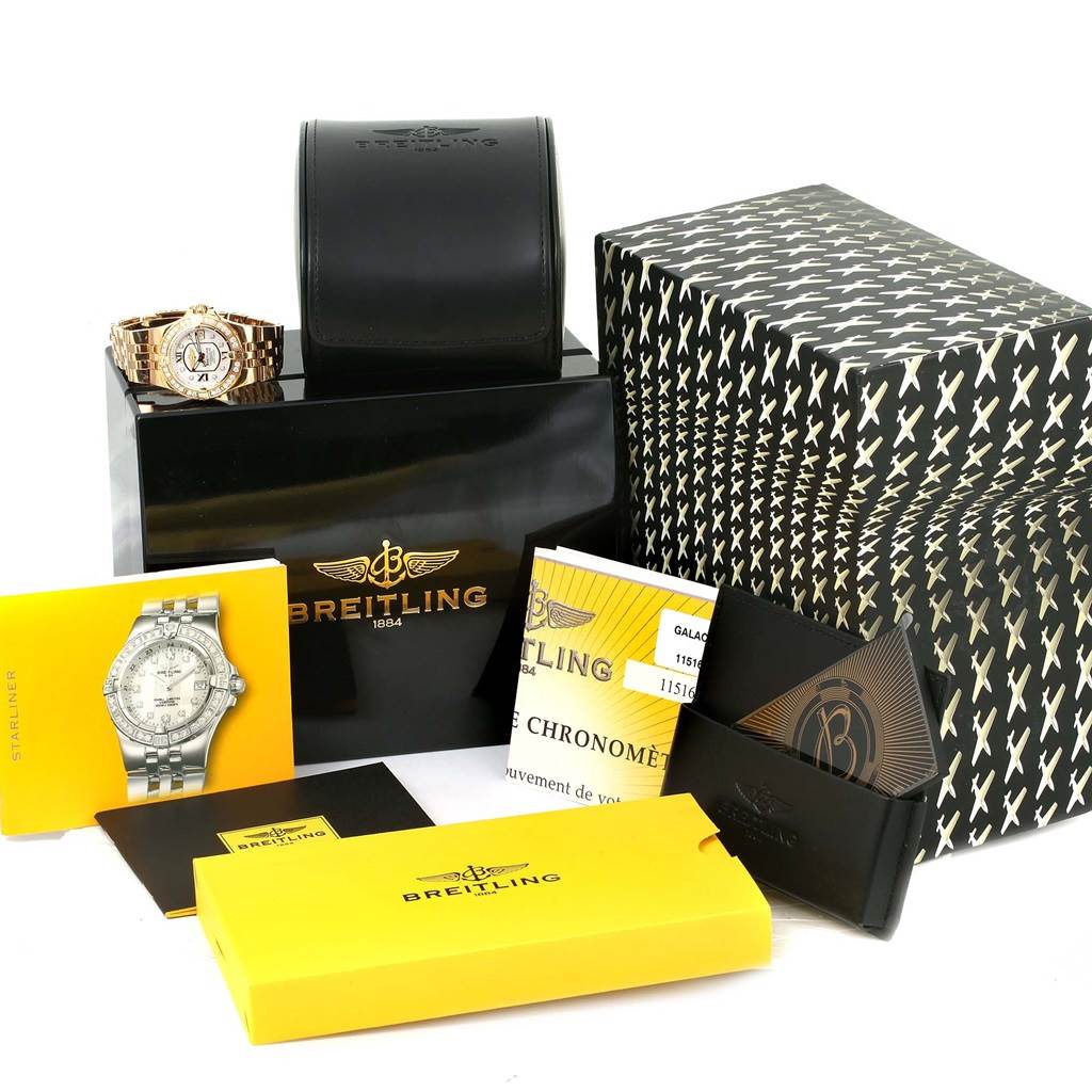 The image shows the Breitling H71340 Women's Rose Gold Mother of Pearl Dial H71340 Women's Rose Gold Mother of Pearl Dial Starliner 30 Mother of Pearl Diamond Watch H71340 and its accessories, including boxes, cases, and papers, from a front angle.