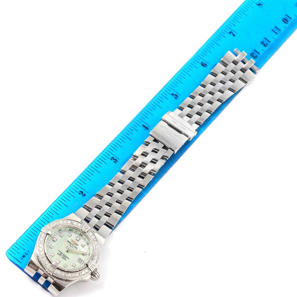 The Breitling A71340 Women's Stainless Steel Mother of Pearl Dial A71340 Women's Stainless Steel Mother of Pearl Dial Starliner Green Mother of Pearl Diamond Ladies Watch A71340 is shown from a top-down angle with the face, bracelet, and clasp visible.