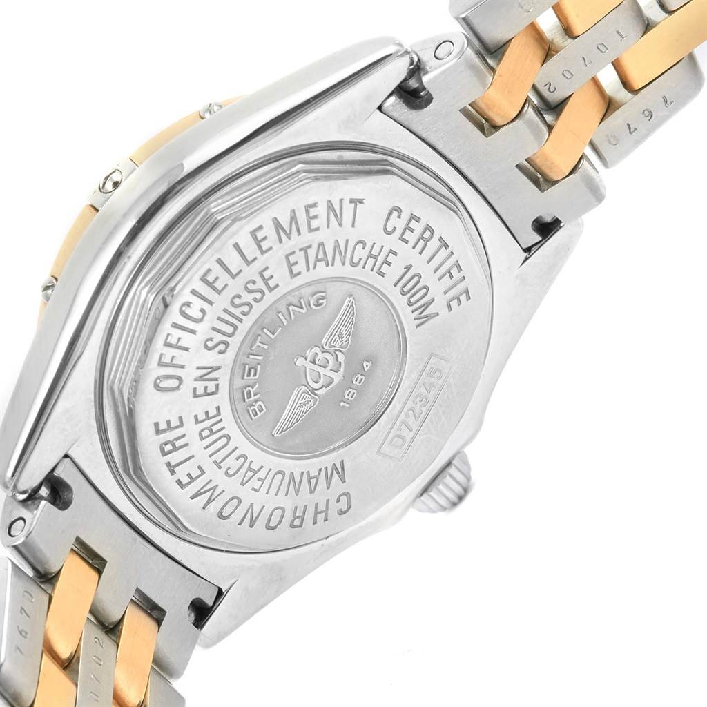 The image shows the back case and part of the bracelet of a Breitling D72345 Women's Stainless Steel Mother of Pearl Dial D72345 Women's Stainless Steel Mother of Pearl Dial Windrider Calisto Steel Yellow Gold Diamond Ladies Watch D72345 model.