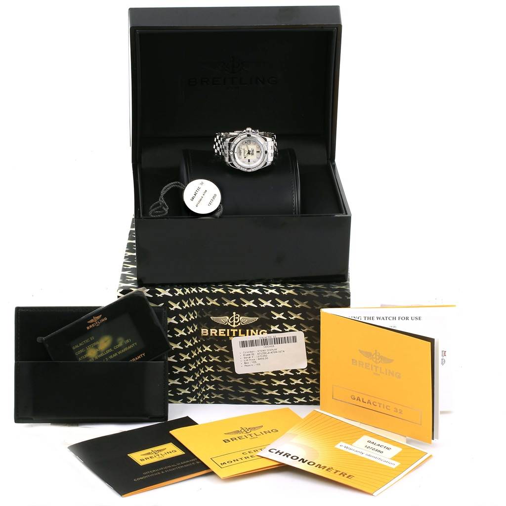 This image shows a Breitling A71356 Women's Stainless Steel Mother of Pearl Dial A71356 Women's Stainless Steel Mother of Pearl Dial Cockpit Mother Pearl Diamond Womens Watch A71356 Unworn and its accessories, including the box and manuals.