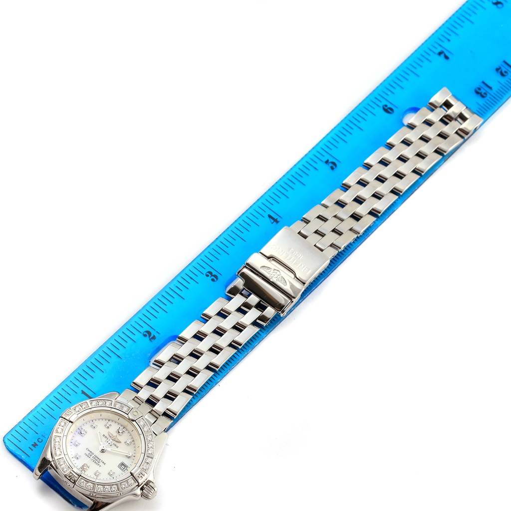 The image shows a Breitling A72345 Women's Stainless Steel Mother of Pearl Dial A72345 Women's Stainless Steel Mother of Pearl Dial Callisto MOP Diamond Ladies Watch A72345 laid flat with a blue ruler beside it to measure the length.
