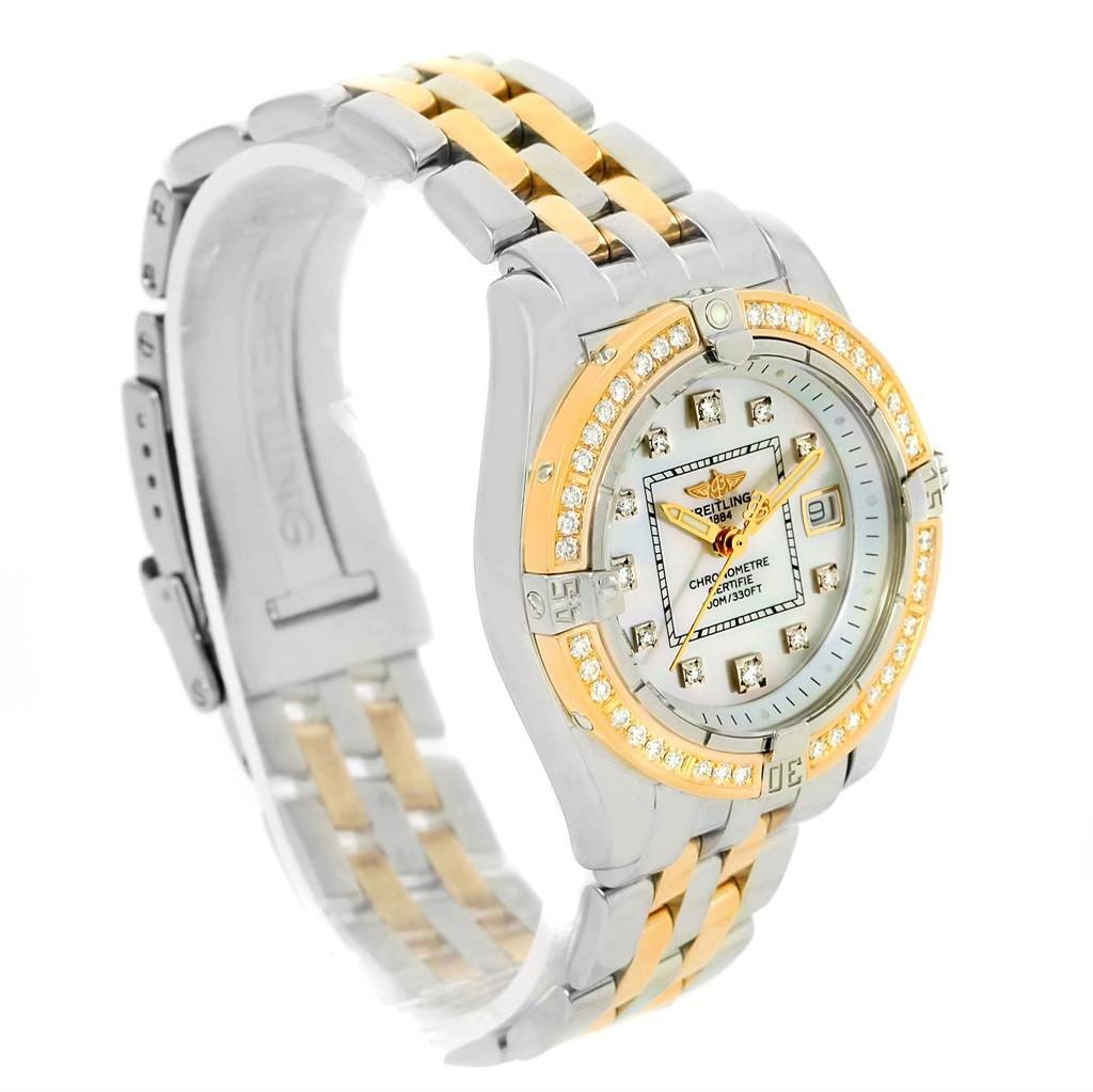 The Breitling D71356 Women's Stainless Steel Mother of Pearl Dial D71356 Women's Stainless Steel Mother of Pearl Dial Cockpit Ladies Steel 18K Yellow Gold Diamond Watch D71356 is shown at a three-quarter angle, highlighting the face, bezel, and bracelet.