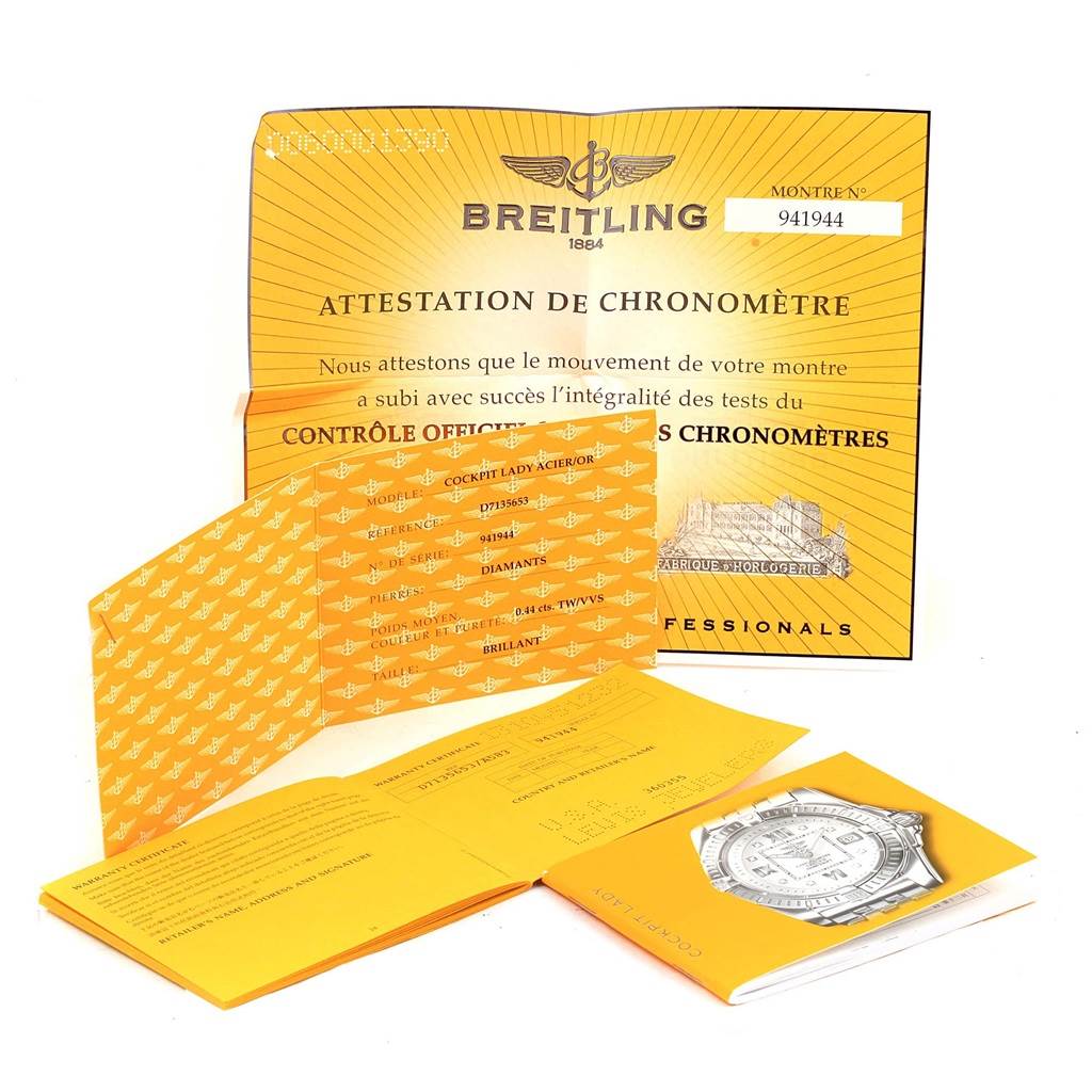 The image shows warranty papers, certificates, and booklets for the Breitling D71356 Women's Stainless Steel Mother of Pearl Dial D71356 Women's Stainless Steel Mother of Pearl Dial Cockpit Ladies Steel 18K Yellow Gold Diamond Watch D71356.