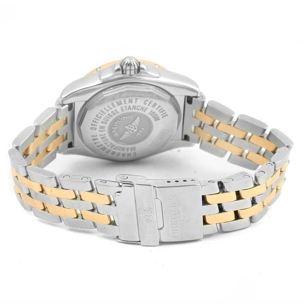 The image shows the back view of the Breitling D71356 Women's Stainless Steel Mother of Pearl Dial D71356 Women's Stainless Steel Mother of Pearl Dial Cockpit Ladies Steel 18K Yellow Gold Diamond Watch D71356, highlighting the case back and two-tone bracelet.