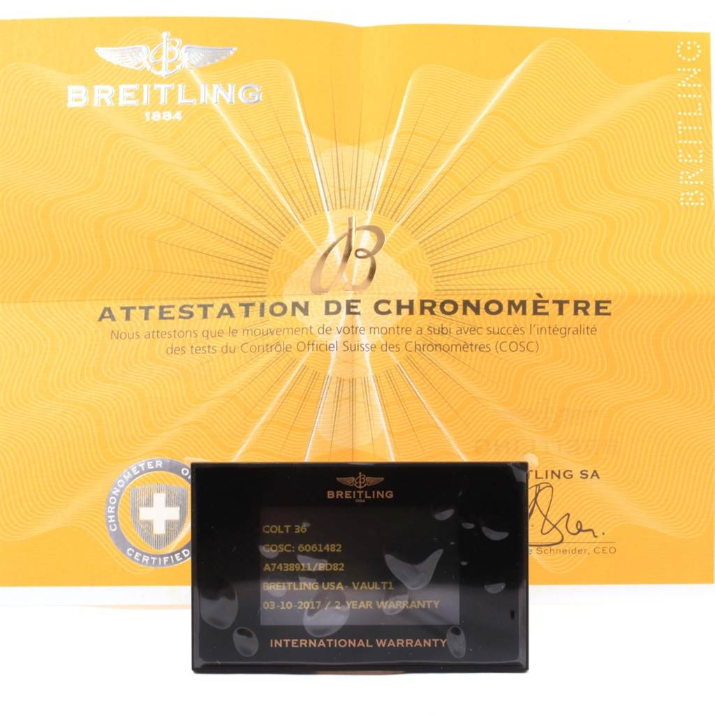 The image shows the warranty card and chronometer certification for the Breitling A74389 Women's Stainless Steel Black Dial A74389 Women's Stainless Steel Black Dial Colt 36 Quartz Steel Men's Watch A74389.