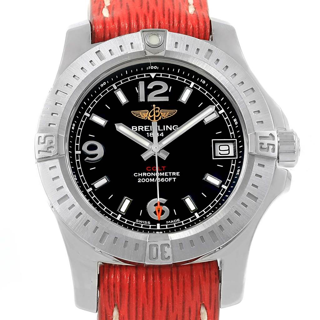 This Breitling A74389 Women's Stainless Steel Black Dial A74389 Women's Stainless Steel Black Dial Colt 36 Quartz Steel Men's Watch A74389 is shown from a front angle, highlighting the face, bezel, crown, and red strap.