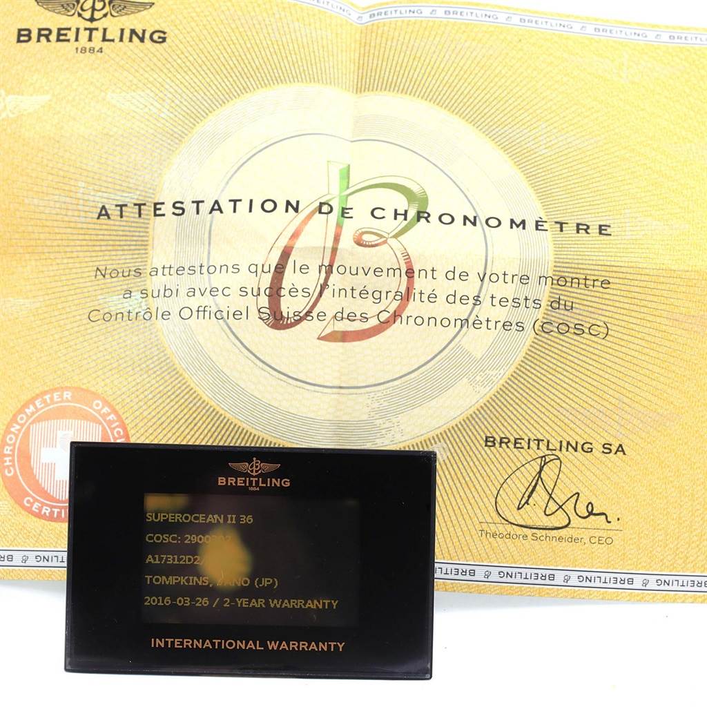 The image shows the certificates for the Breitling A17312D2/A775/230S Women's Stainless Steel White Dial A17312D2/A775/230S Women's Stainless Steel White Dial Superocean II 36, including the COSC certification and the international warranty card.