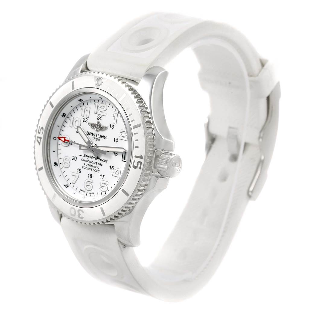 The image shows a Breitling A17312D2/A775/230S Women's Stainless Steel White Dial A17312D2/A775/230S Women's Stainless Steel White Dial Superocean II 36 watch from a front-side angle, highlighting its white rubber strap, bezel, and dial.