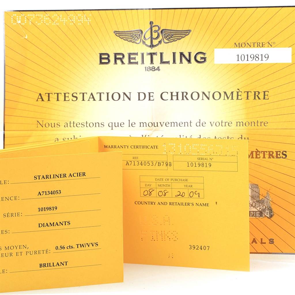 The image shows the box, papers, certificate, and warranty card for a Breitling A71340 Women
s Stainless Steel Mother of Pearl Dial A71340 Women
s Stainless Steel Mother of Pearl Dial Starliner Blue Mother of Pearl Diamond Watch A71340.