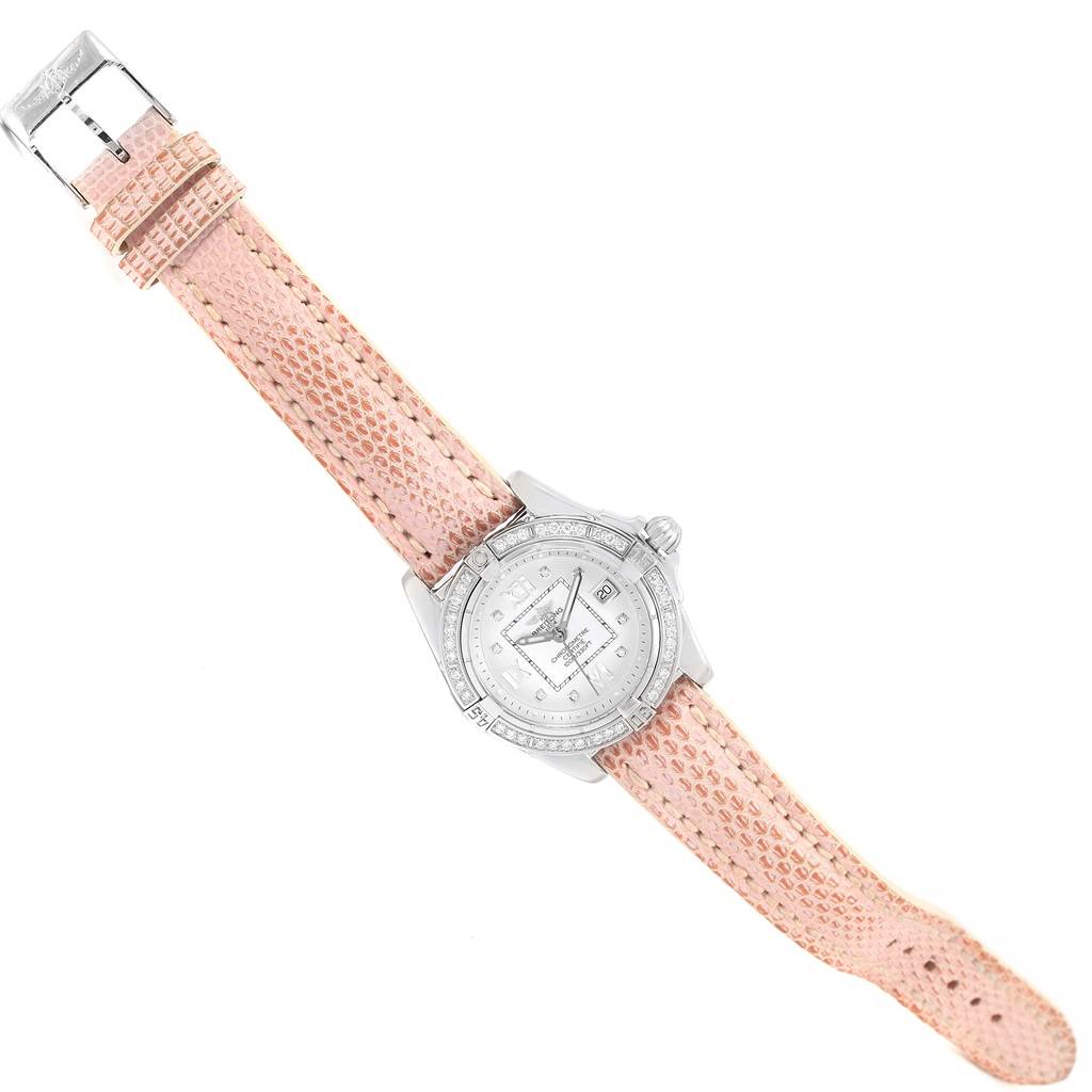 The Breitling A71356 Women's Stainless Steel Silver Dial A71356 Women's Stainless Steel Silver Dial Windrider Cockpit A71356 watch is displayed at an angled aerial view, showing the face with a diamond dial, bezel, and entire light pink strap.