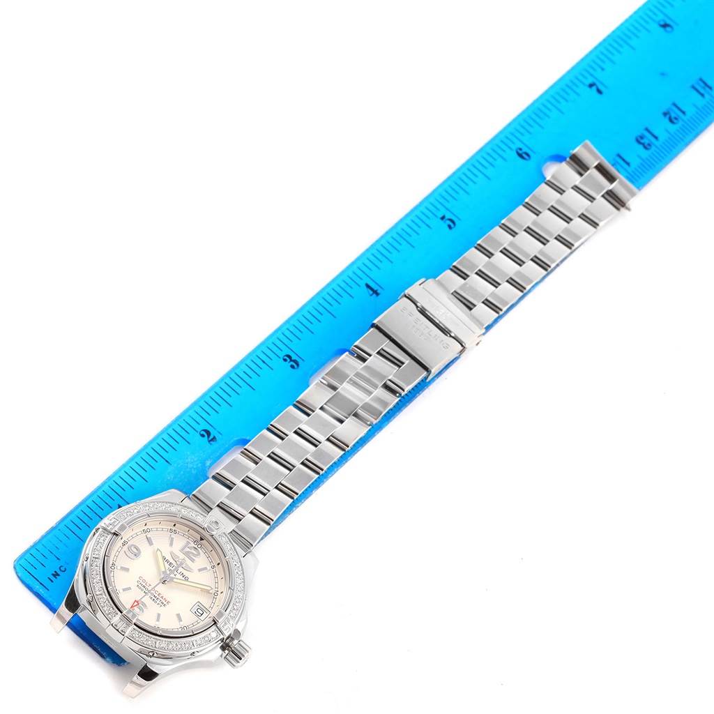 The Breitling A77380 Women's Stainless Steel Silver Dial A77380 Women's Stainless Steel Silver Dial Colt Oceane A77380 watch is shown from a top-down angle, highlighting the face, bezel, bracelet, and clasp.