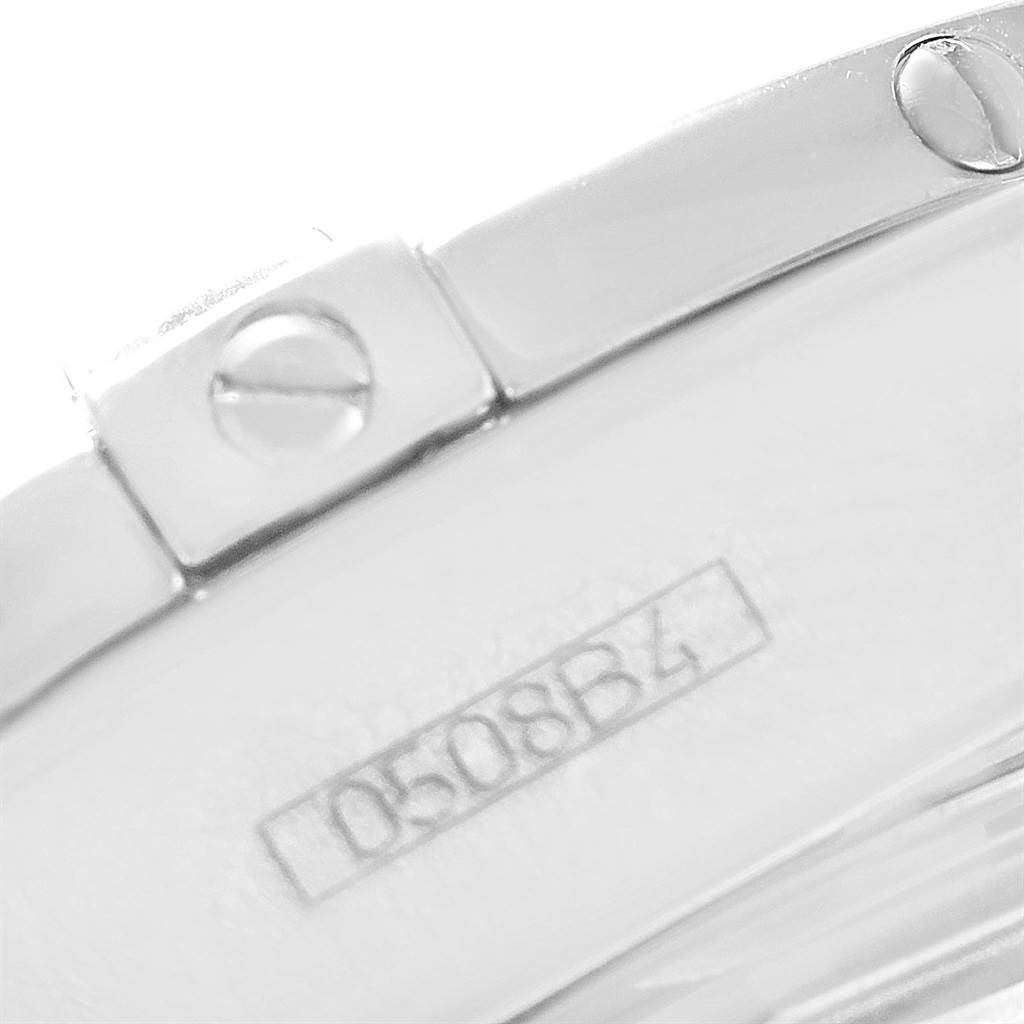 This close-up image of the Breitling A71356 Women's Stainless Steel Mother of Pearl Dial A71356 Women's Stainless Steel Mother of Pearl Dial Cockpit Mother of Pearl Diamond Steel Ladies Watch A71356 model shows part of the bracelet and a serial number.