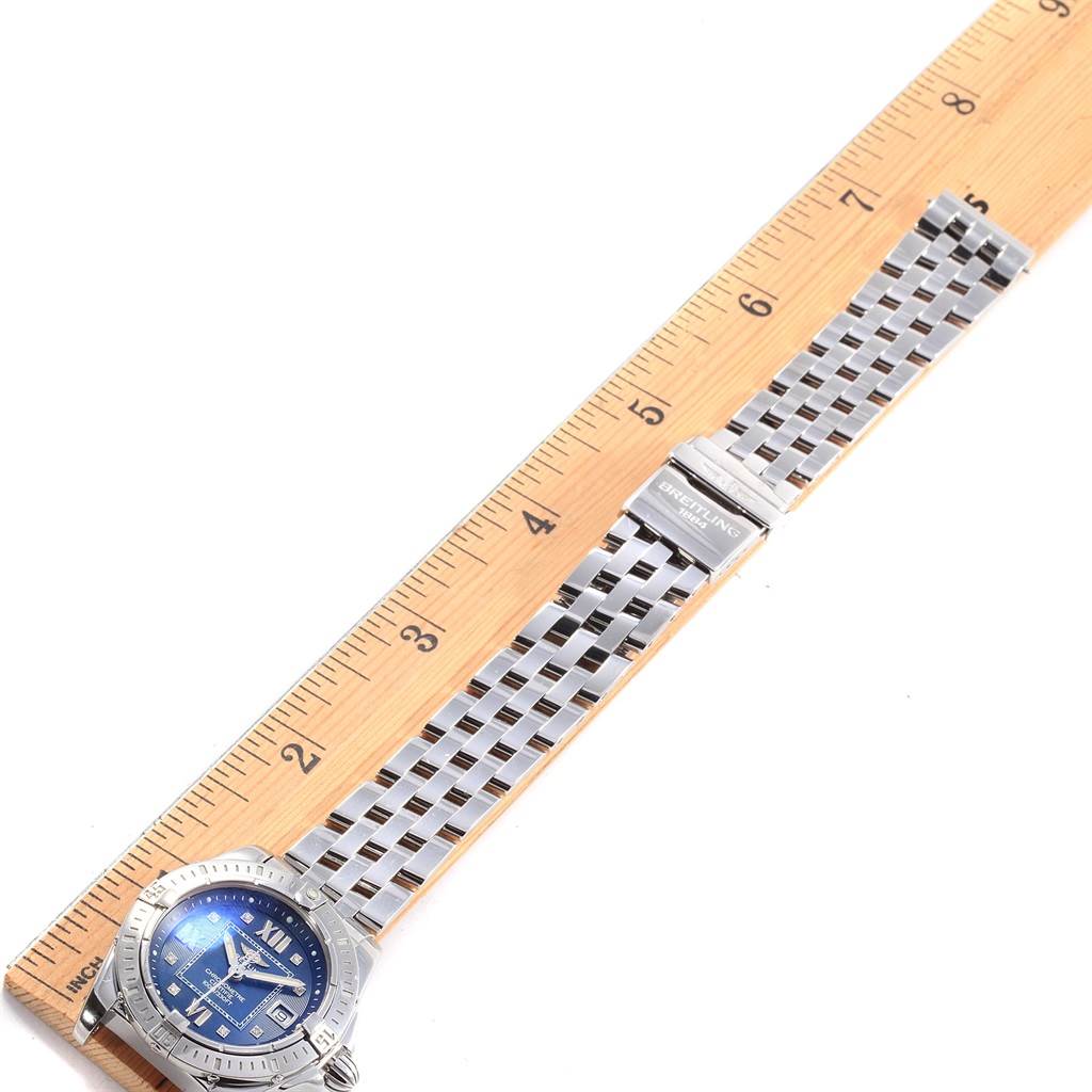 The Breitling A71356 Women's Stainless Steel Blue Dial A71356 Women's Stainless Steel Blue Dial Windrider Cockpit Blue Diamond Dial Ladies Watch A71356 is displayed flat with the strap extended beside a ruler.