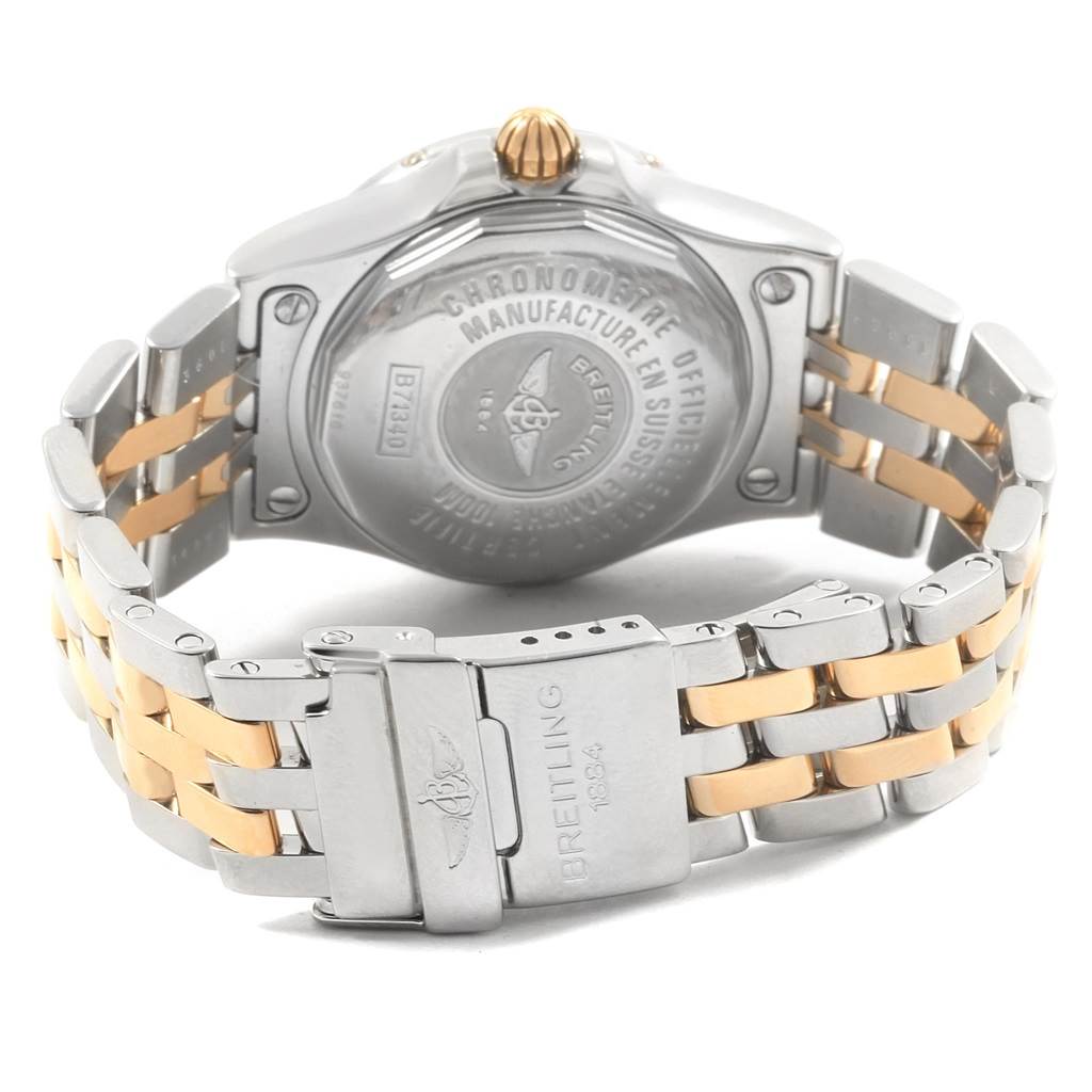 The image shows the back and part of the two-tone bracelet of the Breitling B71340 Women's Steel and Gold (two tone) Mother of Pearl Dial B71340 Women's Steel and Gold (two tone) Mother of Pearl Dial Starliner Steel Yellow Gold MOP Diamond Ladies Watch B71340.