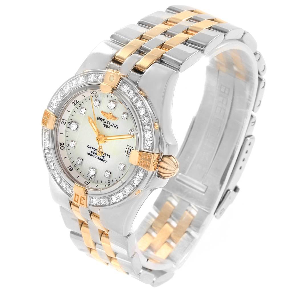 The Breitling B71340 Women's Steel and Gold (two tone) Mother of Pearl Dial B71340 Women's Steel and Gold (two tone) Mother of Pearl Dial Starliner Steel Yellow Gold MOP Diamond Ladies Watch B71340 is shown from a top-left angle, highlighting the dial and bracelet.
