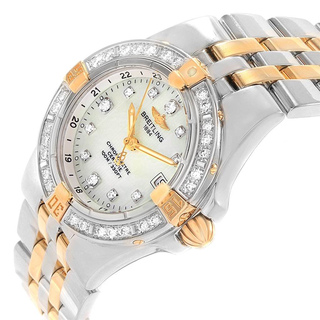 The image shows a close-up, angled view of the Breitling B71340 Women's Steel and Gold (two tone) Mother of Pearl Dial B71340 Women's Steel and Gold (two tone) Mother of Pearl Dial Starliner B71340 dial, bezel with diamonds, and two-tone bracelet.