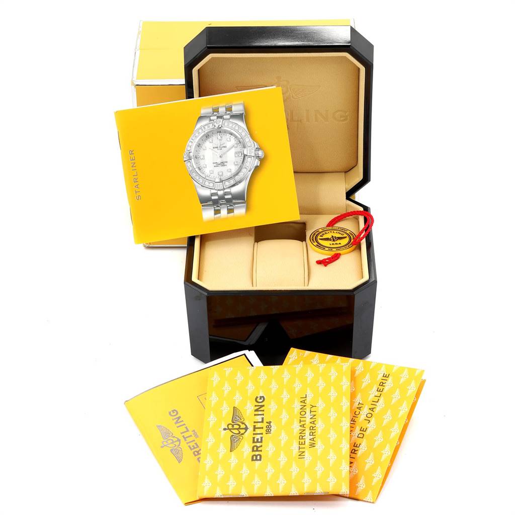 The image shows the packaging, box, papers, and manuals for the Breitling A71340 Women's Stainless Steel Mother of Pearl Dial A71340 Women's Stainless Steel Mother of Pearl Dial Starliner Blue MOP Diamonds Ladies Watch A71340.
