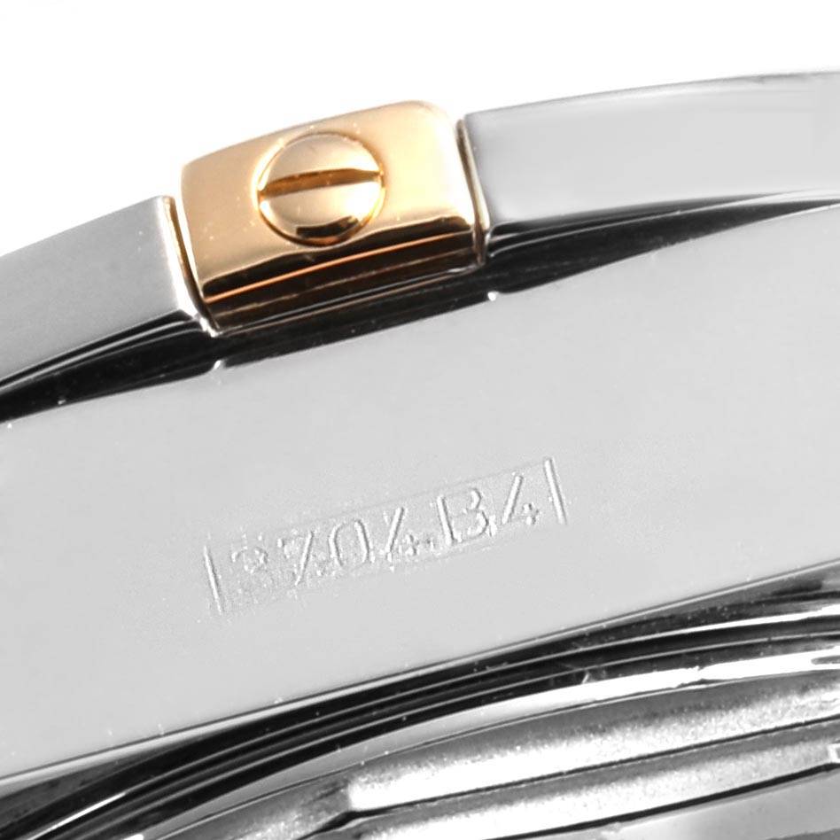 This image shows a close-up of the clasp and part of the bracelet of the Breitling B71356 Women's Steel and Gold (two tone) Mother of Pearl Dial B71356 Women's Steel and Gold (two tone) Mother of Pearl Dial Cockpit Steel Yellow Gold Diamond Ladies Watch B71356.