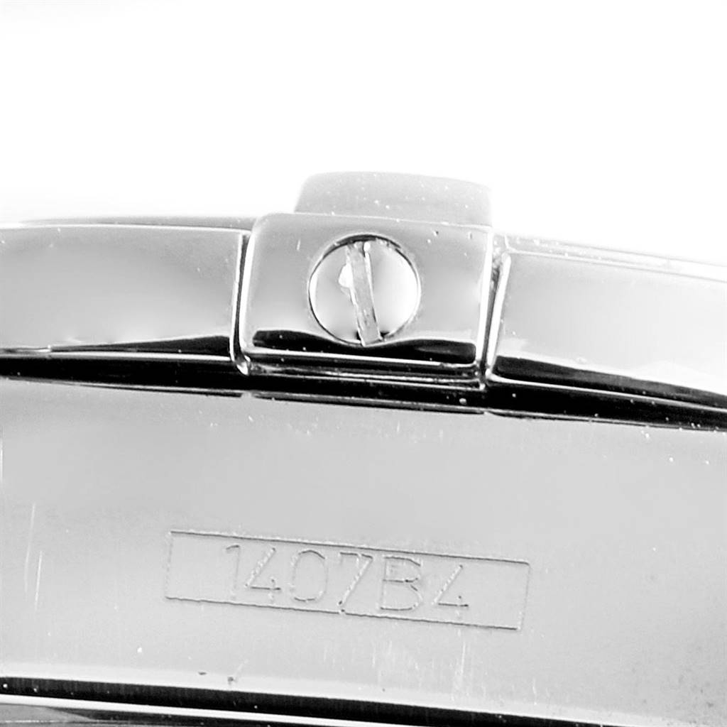 The image shows the side angle of the Breitling A71356 Women
s Stainless Steel Mother of Pearl Dial A71356 Women
s Stainless Steel Mother of Pearl Dial Cockpit Mother of Pearl Diamond Ladies Watch A71356, focusing on the clasp and model number 1407B4.