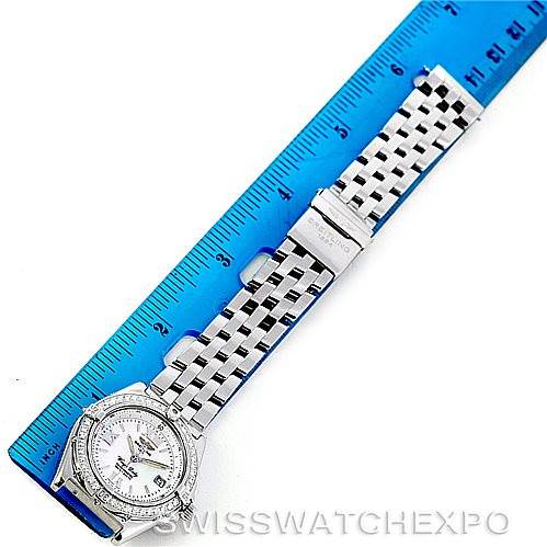 The image shows the Breitling Women's Stainless Steel Mother of Pearl Dial Women's Stainless Steel Mother of Pearl Dial Windrider Wings Ladies MOP Diamond Watch A67350 model laid out flat, with a ruler next to it for measurement.