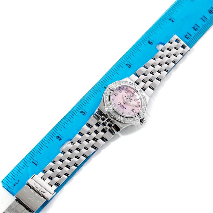 The image shows a top-down angle of the Breitling A71340 Women's Stainless Steel Mother of Pearl Dial A71340 Women's Stainless Steel Mother of Pearl Dial Starliner Ladies Mother of Pearl Diamond Watch A71340 with a ruler for scale.