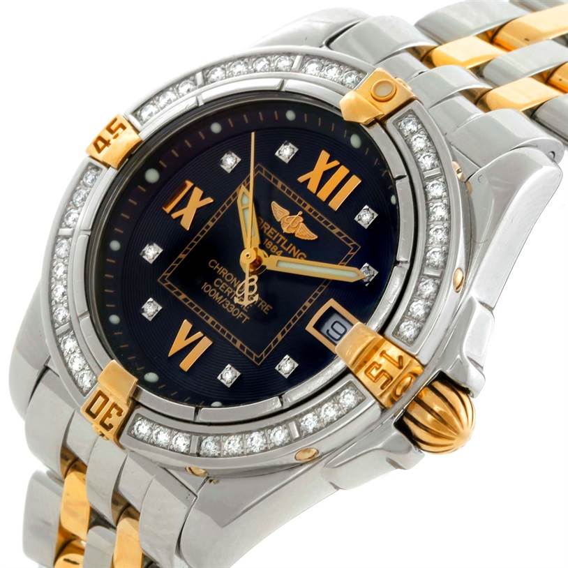 This image shows a close-up view of the Breitling B71356 Women
s Steel and Gold (two tone) Black Dial B71356 Women
s Steel and Gold (two tone) Black Dial Cockpit Ladies Steel 18K Yellow Gold Diamond Watch B71356, highlighting the face, bezel, and part of the band.