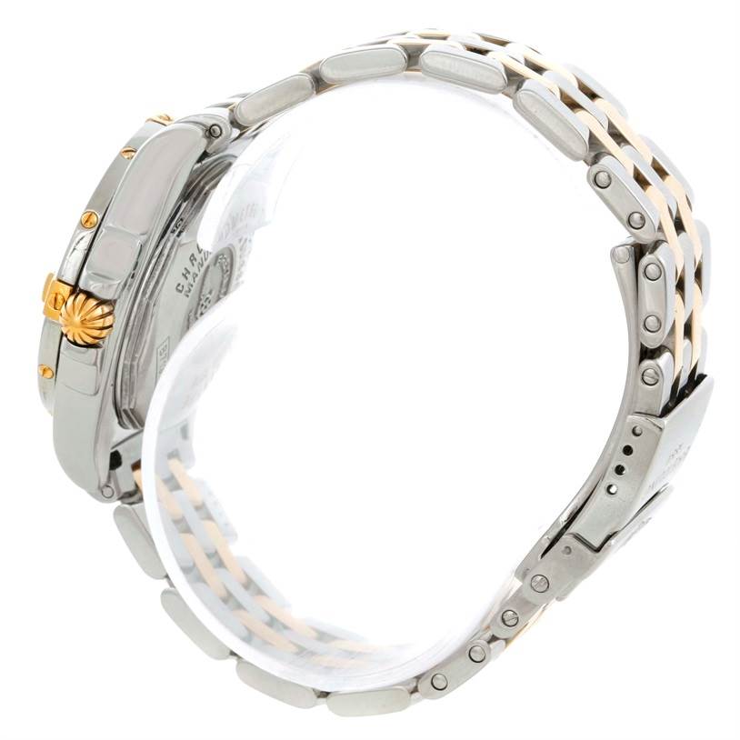 The side angle of the Breitling B71356 Women
s Steel and Gold (two tone) Black Dial B71356 Women
s Steel and Gold (two tone) Black Dial Cockpit Ladies Steel 18K Yellow Gold Diamond Watch B71356 model shows the crown, case, and two-tone bracelet.