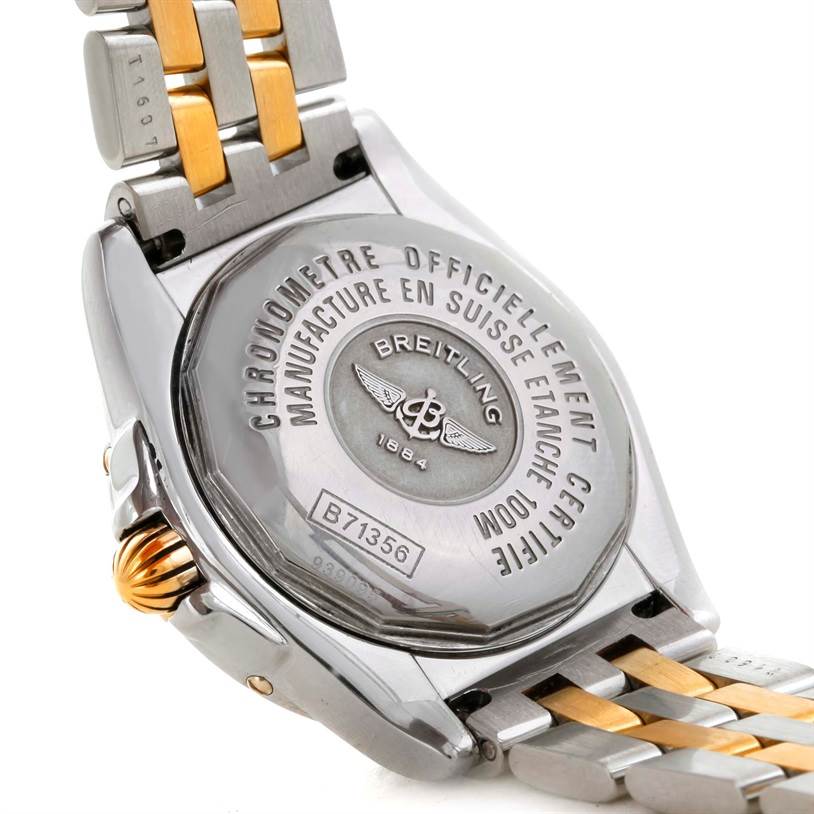 The image shows the back case and part of the two-tone band of the Breitling B71356 Women
s Steel and Gold (two tone) Black Dial B71356 Women
s Steel and Gold (two tone) Black Dial Cockpit Ladies Steel 18K Yellow Gold Diamond Watch B71356.