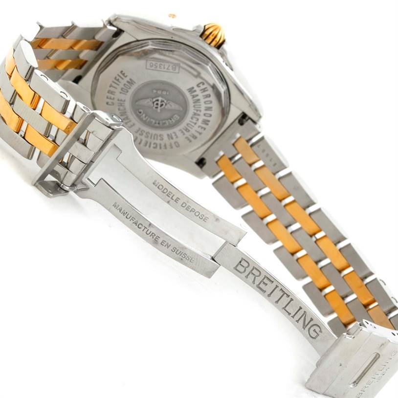 The image shows the back and clasp of a Breitling B71356 Women
s Steel and Gold (two tone) Black Dial B71356 Women
s Steel and Gold (two tone) Black Dial Cockpit Ladies Steel 18K Yellow Gold Diamond Watch B71356 model, focusing on the bracelet and case back.