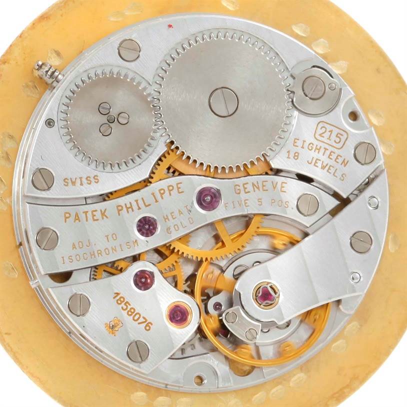 This image shows the intricate movements and internal parts of a Patek Philippe Calatrava 5022 Men's Yellow Gold Champagne Dial 5022 Men's Yellow Gold Champagne Dial model watch, focusing on the mechanics.