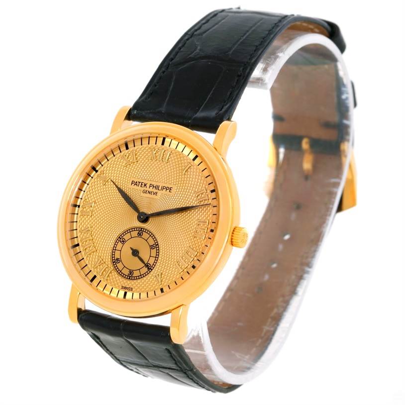 The image shows a Patek Philippe Calatrava 5022 Men's Yellow Gold Champagne Dial 5022 Men's Yellow Gold Champagne Dial watch from a front and slightly oblique angle, highlighting its gold case and black leather strap.