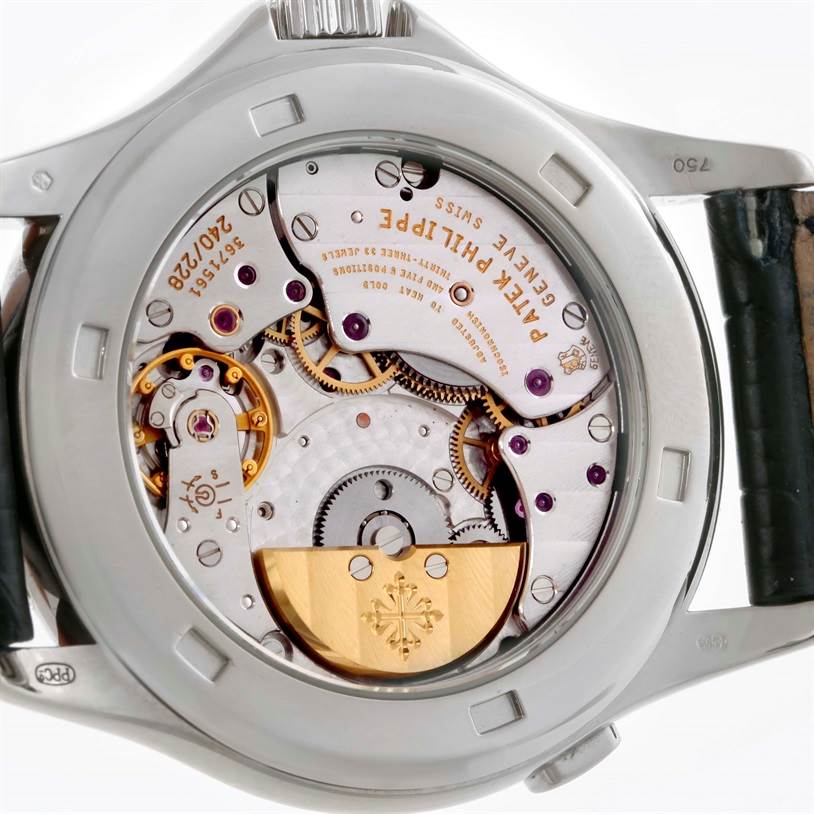 The image shows the back view of the Patek Philippe Complications 3802R Men's White Gold Silver Dial 3802R Men's White Gold Silver Dial model, highlighting its intricate inner movements.