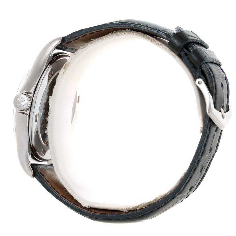 The image shows a side view of a Patek Philippe Complications 3802R Men's White Gold Silver Dial 3802R Men's White Gold Silver Dial watch, highlighting its crown, case, and leather strap with a buckle.