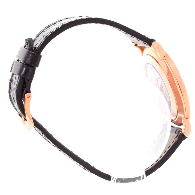 The image shows a side view of a Patek Philippe Calatrava 5119R Men's Rose Gold White Dial 5119R Men's Rose Gold White Dial watch, highlighting its strap, buckle, and case.