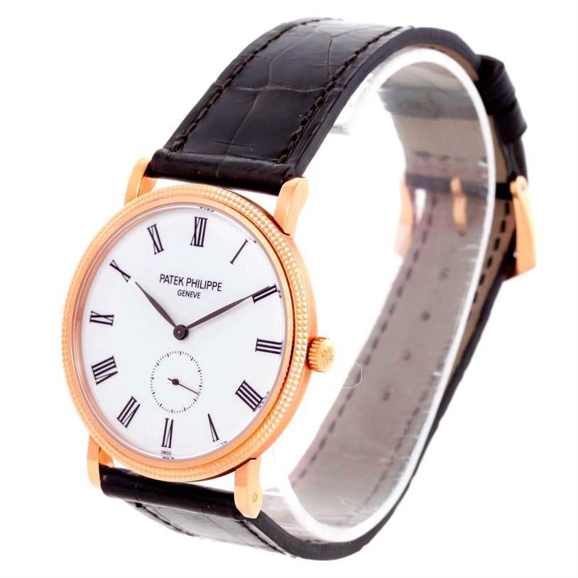 The Patek Philippe Calatrava 5119R Men's Rose Gold White Dial 5119R Men's Rose Gold White Dial watch is shown from a front angle, highlighting its round dial, Roman numerals, and leather strap.