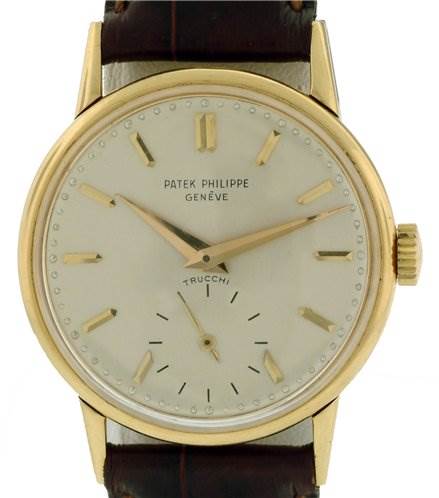 The image shows a front view of a Vintage Patek Philippe watch, highlighting the dial, hands, and leather strap.