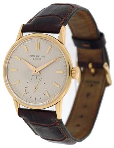 The image shows a Vintage Patek Philippe watch at a three-quarter angle, displaying the face, hands, crown, and brown leather strap.