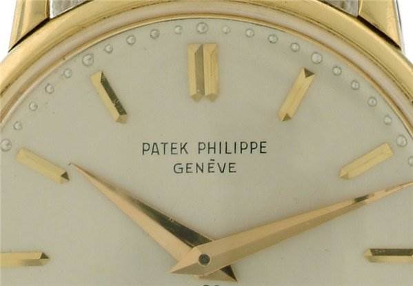 This image shows a close-up of the dial and hands of a Vintage Patek Philippe watch.