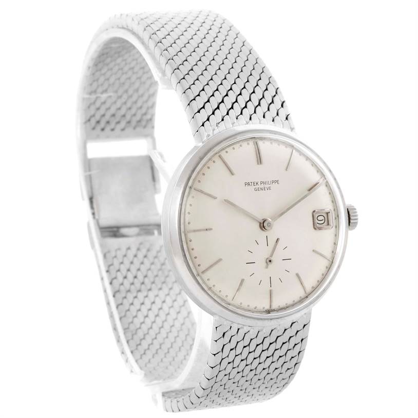 This image shows a Patek Philippe Vintage watch from an angled side view, highlighting the dial, mesh bracelet, and clasp.